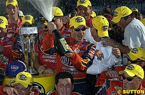 Winner Jeff Gordon sprays the champagne