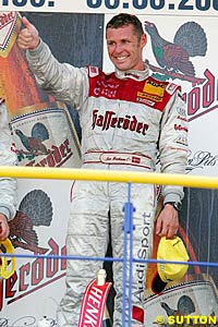 Winner Tom Kristensen on the podium