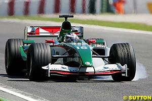 Christian Klien locks the front wheel of his Jaguar