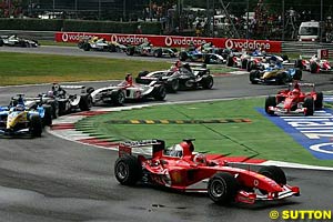 Rubens Barrichello leads the start