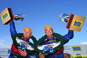 Greg Ritter and Marcos Ambrose celebrate their victory