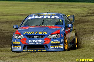 The moment when Marcos Ambrose was fearing the worst as co-driver Greg Ritter tries to recover from the wet grass