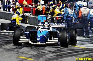 Patrick Carpentier exits a pit stop on his way to victory