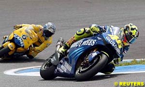 Winner Valentino Rossi leads second place finisher Makoto Tamada early in the race