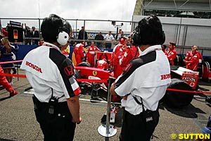 Honda engineers eye up the 2004 Ferrari