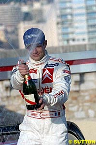 Monte Carlo winner Sebastien Loeb sprays the champers