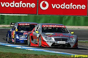 Bernd Schneider holds off Martin Tomczyk