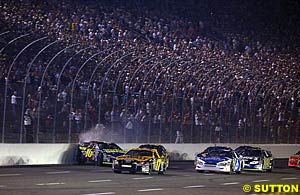 The beginning of the crash in segment one, with Greg Biffle sideways against the wall