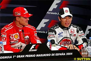 Michael Schumacher and Takuma Sato in Spain