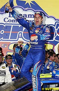 Winner Jeff Gordon celebrates with his own plastic bottle