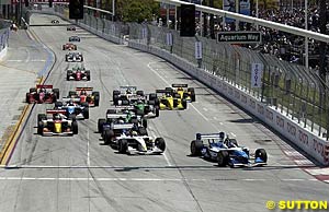 Paul Tracy leads the field into turn one at the start