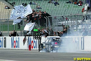 Hockenheim winner Gary Paffett smokes the brakes after taking victory