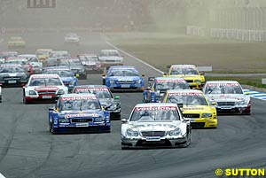 Jean Alesi leads the field into turn one at the start