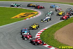 Vitantonio Liuzzi leads the field through turn two on lap one