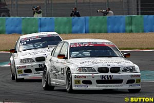 Race one winner Dirk Muller leads Jorg Muller