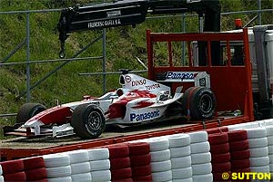 A Toyota is towed back to the pits after a failure