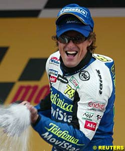 Winner Sete Gibernau celebrates on the podium