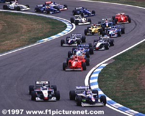 Villeneuve takes first from Coulthard at the second corner
