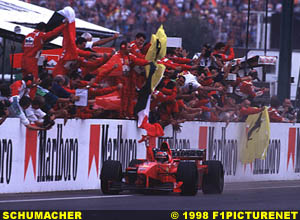 Schumacher greets team