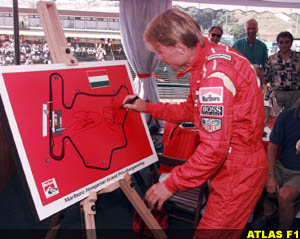 Hakkinen signs track map