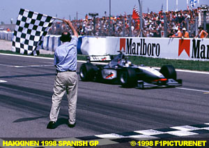 Hakkinen takes chequered flag