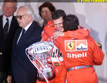 Schumacher hugs Jean Todt