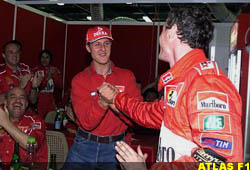 Michael Schumacher congradulates Eddie Irvine