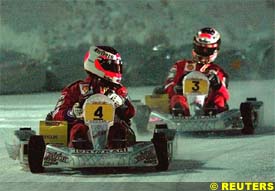 Barrichello laps Schumacher in the ice-kart race, today
