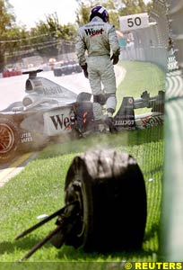 Coulthard walks away after crash