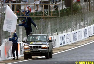 Officials take down a broken ad banner, today