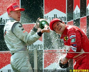 Hakkinen and Barrichello celebrate on the podium