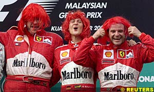 Brawn, Schumacher and Barrichello on the podium in red wigs
