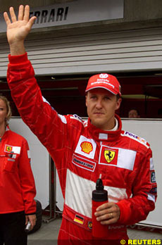 Michael Schumacher celebrates his 30th pole