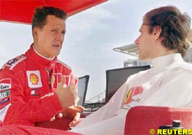 Michael Schumacher talks to Luca Badoer, today