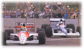 Jean Alesi battles Ayrton Senna at the US GP